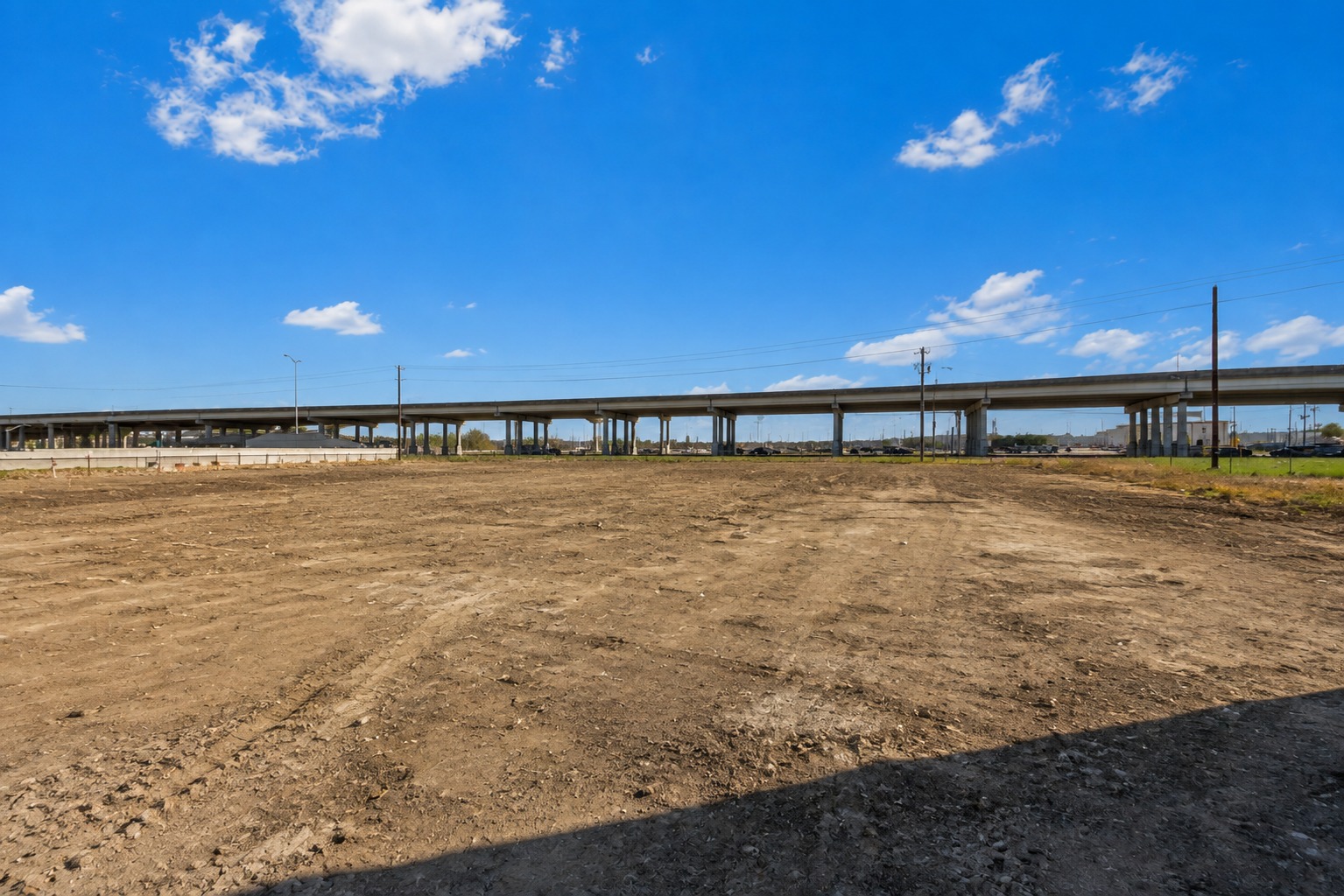 Before: cleared and graded commercial lot ready for construction in the Houston area
